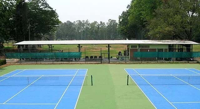 Two outdoor hard tennis courts at Chiang Mai Gymkhana Club